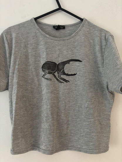 L Women's Rhino Beetle and M Men's Longsleeve Pterosaur